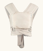 Close Caboo Lite Baby Carrier in Blush cream front view, showing wide shoulder straps, ring adjustment, and soft front panel.