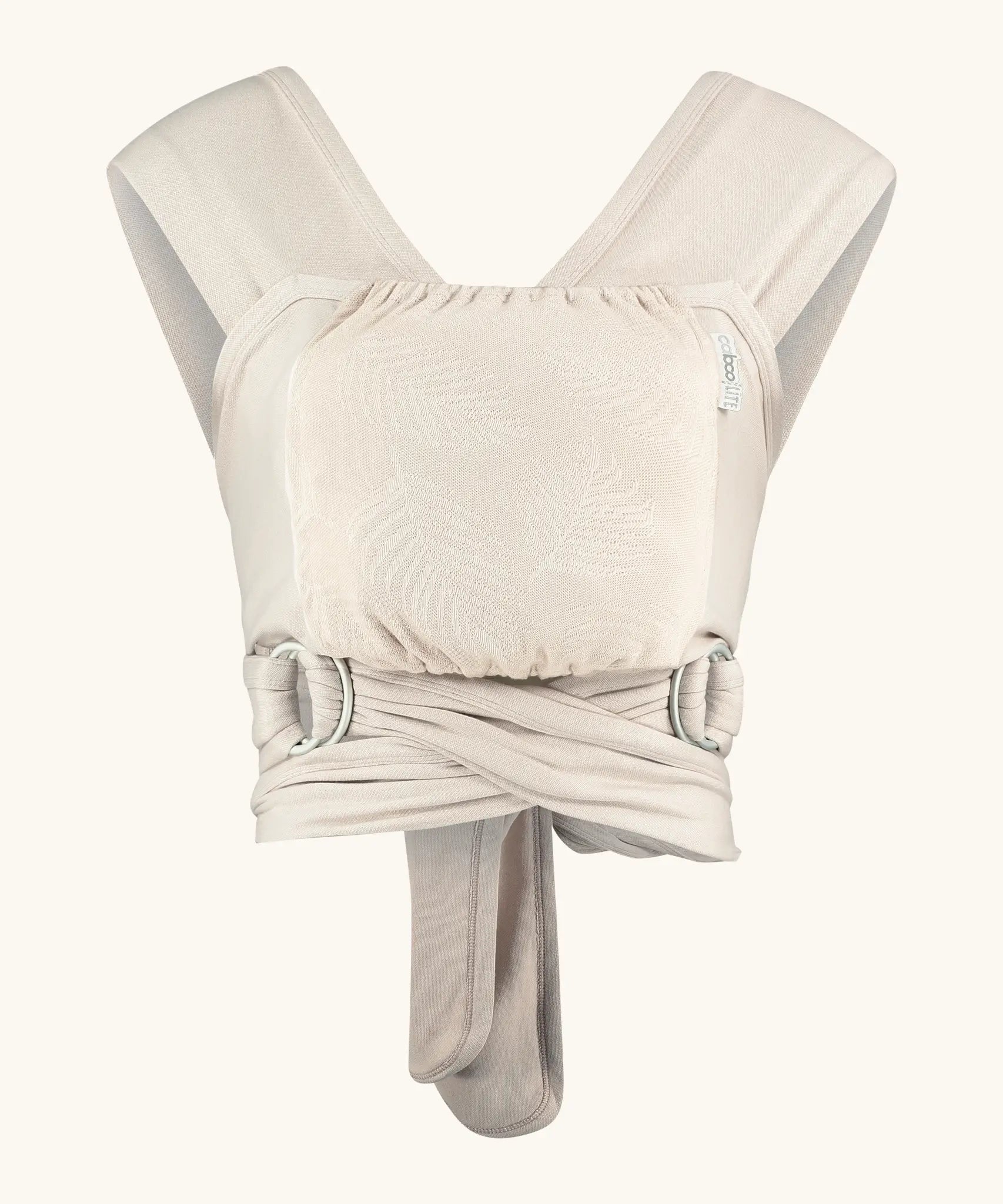 Close Caboo Lite Baby Carrier in Blush cream front view, showing wide shoulder straps, ring adjustment, and soft front panel.