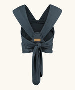 Close Caboo Organic Baby Carrier in blueberry back view, showing wide shoulder straps and tie waist adjustment strap