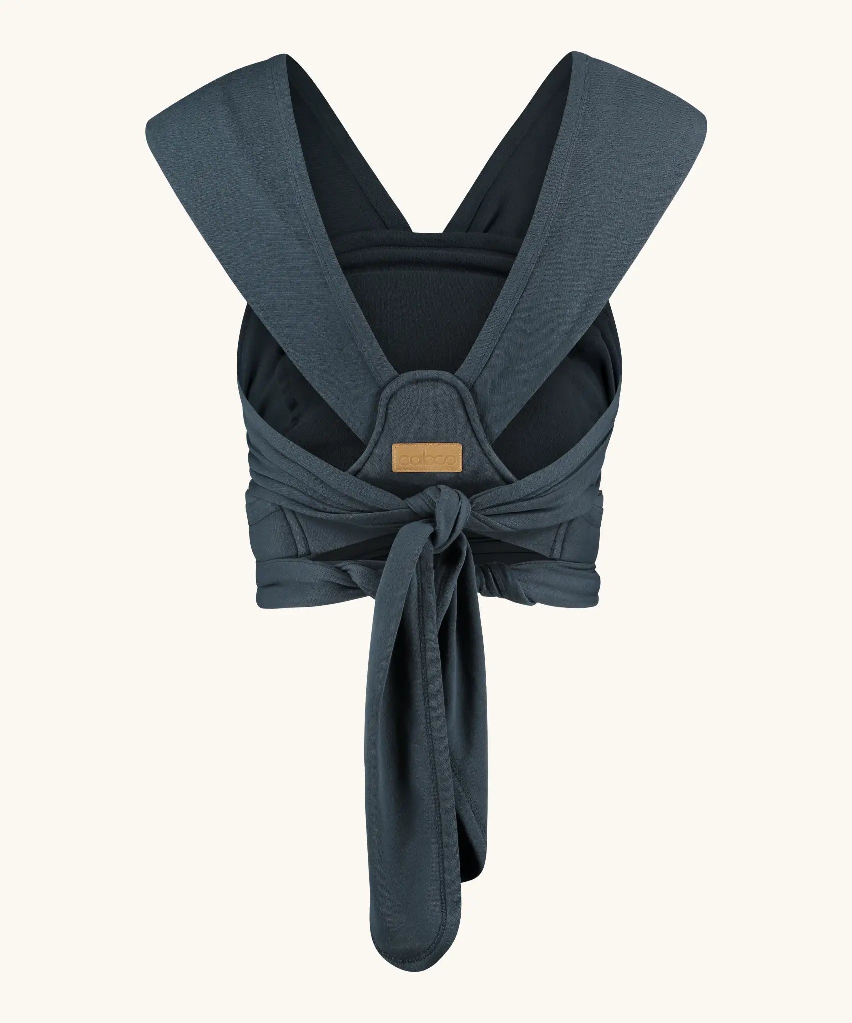 Close Caboo Organic Baby Carrier in blueberry back view, showing wide shoulder straps and tie waist adjustment strap