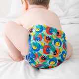 A baby wearing the Close Pop-In x Babipur exclusive reusable nappy wrap, in a Babipur Cwtch print