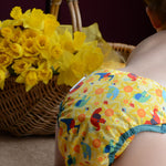 Baby wearing a Babipur and Close exclusive Dewi cloth nappy
