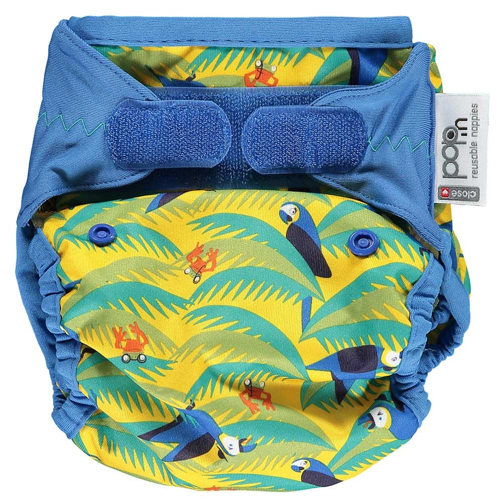 The Close Parent Pop-in reusable nappy wrap cover with velcro closures, in a parrot print