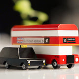 Close up of the Candylab wooden London Bus and London Taxi toys on a white background