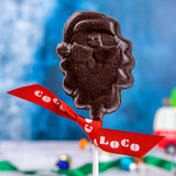 A Cocoa Loco Dark Chocolate Santa Lolly. These dark chocolate Christmas lollies are free from UPF ingredients. 