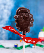 A Cocoa Loco Dark Chocolate Santa Lolly. These dark chocolate Christmas lollies are free from UPF ingredients. 
