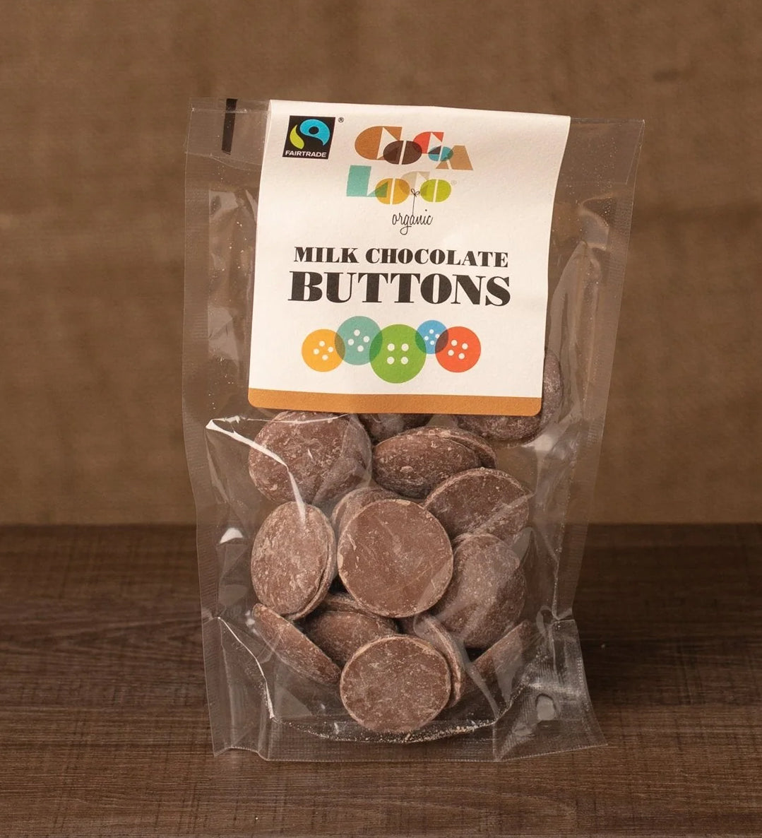 Cocoa Loco Milk Chocolate Buttons in a 100g pack. These chocolate buttons are organic, Fairtrade and free from UPF.