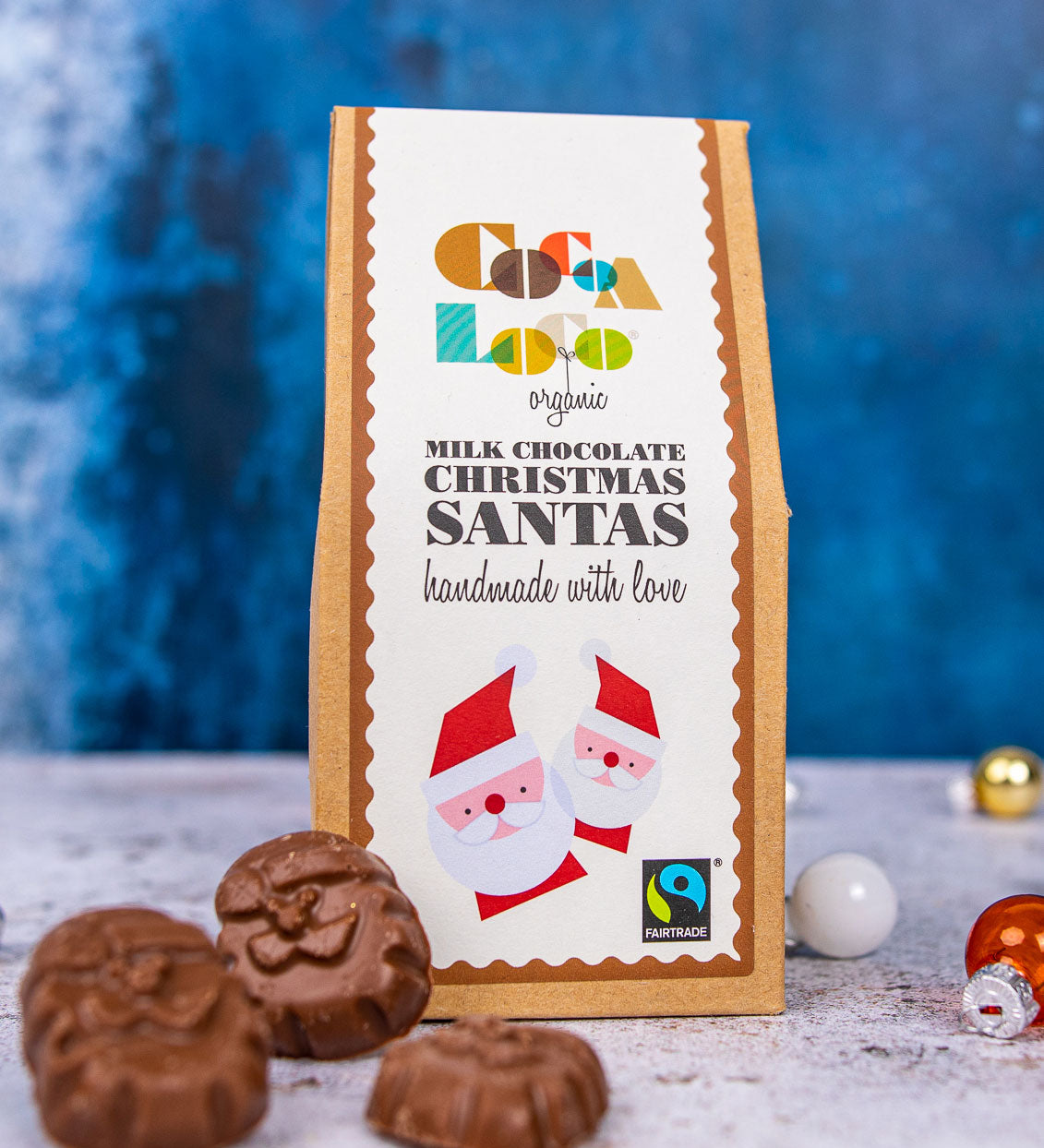 A pack of Cocoa Milk Chocolate Santas. These Chrimas Santa shaped santas are made with UPF free, organic and Fairtrade chocolates. 