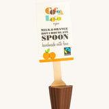 Cocoa Loco Milk and Orange Hot Chocolate Spoon. 30g of UPF free, organic, Fairtrade chocolate orange chocolate on a wooden spoon.