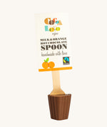 Cocoa Loco Milk and Orange Hot Chocolate Spoon. 30g of UPF free, organic, Fairtrade chocolate orange chocolate on a wooden spoon.