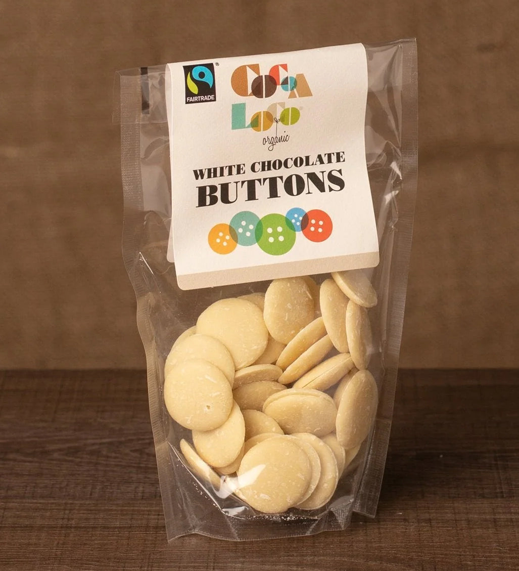 Cocoa Loco White Chocolate Buttons in a 100g pack. These white chocolate buttons are organic, Fairtrade and free from UPF.