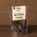 jar and scoop filled with Cocoa Loco organic Fairtrade chocolate buttons on a wooden table