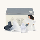 The Lola & Lykke Complete Breast Pump Spare Parts, in front of their box