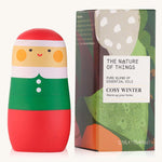 Cosy Winter Christmas pure essential oil blend in a blue glass bottle in front of a decorative festive cardboard box. 