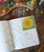 Crafting Magical Window Stars tutorial book written by Frédérique Guéret. View of one of the how to guides inside. 