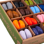 Close up of the natural soy wax Crayon Rocks in their cardboard box on a white background