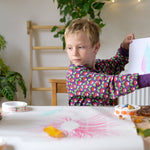Child sat at a table