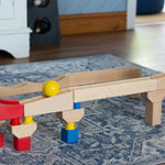 Nic Cubio wooden Ball Track Extension Set shown set up with a red  and yellow ball shown on motion on the track. Wooden balls are available to purchase separately. 