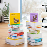 Cuboro children's wooden marble run toy set stacked in 2 towers on a wooden floor