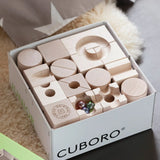 Close up of the contents of the Cuboro junior marble set in it's box.