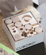 Close up of the contents of the Cuboro junior marble set in it's box.