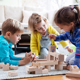 Children playing with the Cuboro junior marble set, set up on the floor.