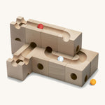 Cuboro children's pro wooden marble run toy blocks stacked on a cream background