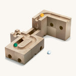 Cuboro kids wooden speed marble run accessory set laid out on a cream background