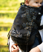 Didymos didyfix carrier in blue blossom with a baby sitting inside showing close up of the design on cotton fabric