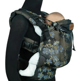 Side of Didymos didyfix carrier in blue blossom shown on mannequin. A soft structured full buckle carrier made from cotton