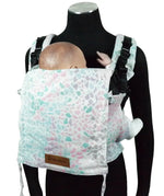 Front of Didymos didyfix carrier in summer mosaic shown on mannequin. A soft structured full buckle carrier made from cotton