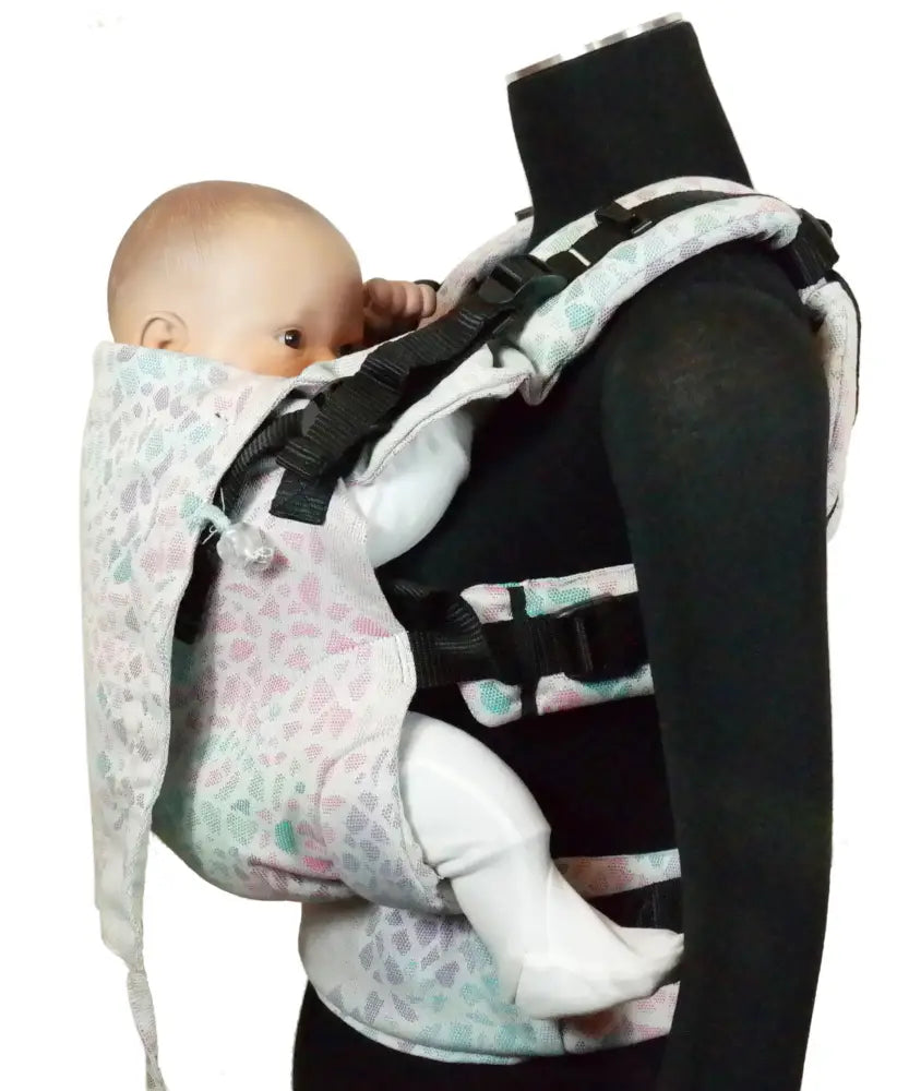 Side of Didymos didyfix carrier in summer mosaic shown on mannequin. A soft structured full buckle carrier made from cotton