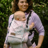 Mother with a baby sitting inside a Summer mosaic Didymos didyfix soft structured cotton carrier 