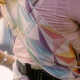 Didymos didyflow half buckle zephyr cotton carrier showing a close up of double layered shoulder straps and the half buckle, half tie feature on the waist belt 