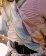 Didymos didyflow half buckle zephyr cotton carrier showing a close up of double layered shoulder straps and the half buckle, half tie feature on the waist belt 