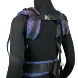 Back of a Didymos didyfix baby carrier in mosaic in the dark shown on mannequin. showing padded shoulder straps and buckle fasteners
