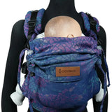 Front of Didymos didyfix carrier in mosaic in the dark design shown on a mannequin. A soft structured full buckle carrier made from cotton