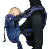 Side of Didymos didyfix carrier in mosaic in the dark design shown on mannequin. A soft structured full buckle carrier made from cotton