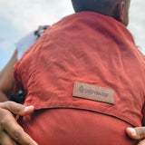 Didymos didyfix toddler carrier in rusty red. A full buckle carrier with a soft structure made from cotton