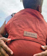 Didymos didyfix toddler carrier in rusty red. A full buckle carrier with a soft structure made from cotton