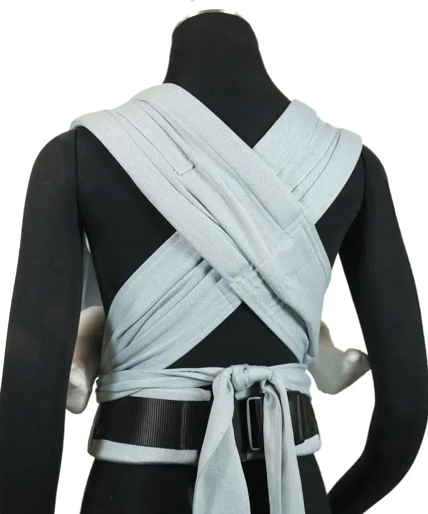 Back of Didymos didyflow baby carrier in ocean showing half buckle half tie waist belt and double layered tie on shoulder straps