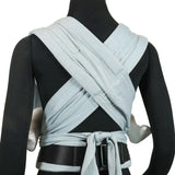 Back of Didymos didyflow baby carrier in ocean showing half buckle half tie waist belt and double layered tie on shoulder straps