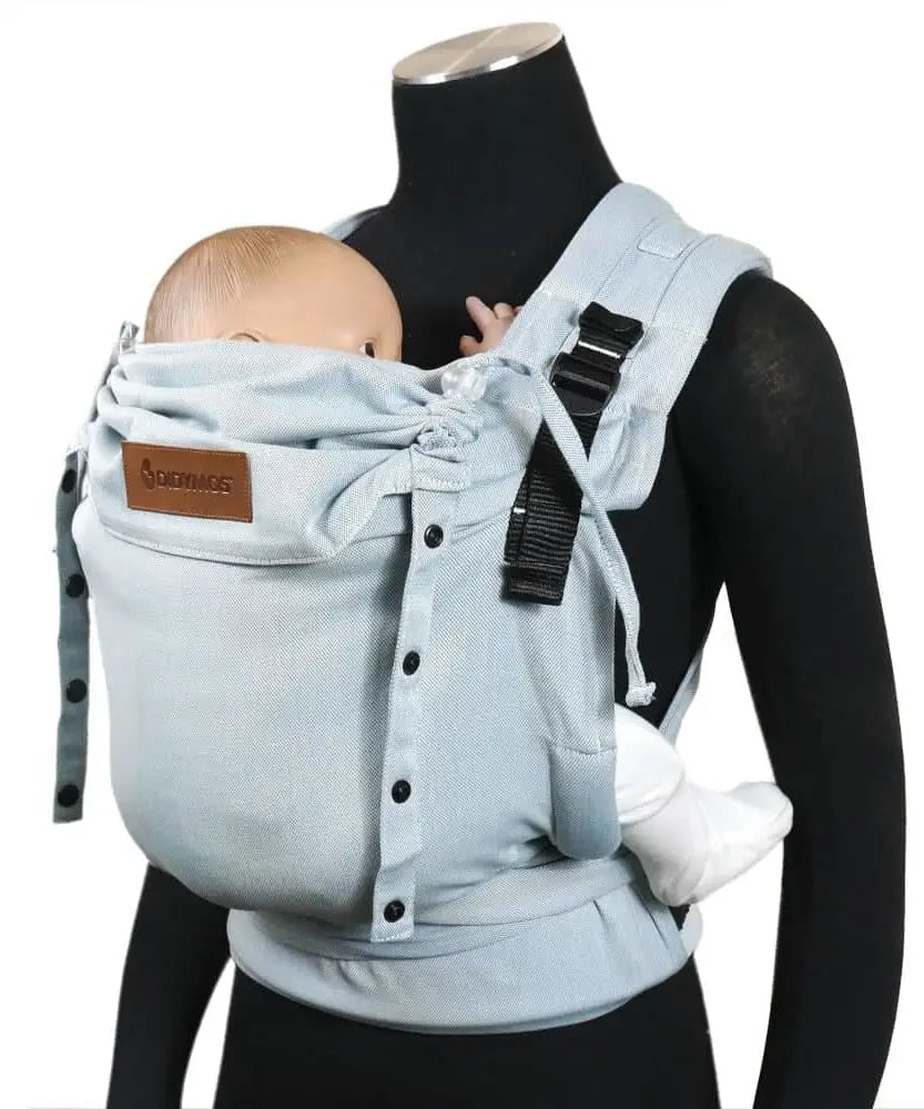 Side of a Didymos didyflow half buckle half tie cotton carrier in ocean shown on a mannequin showing adjsutable neck/head rest detail