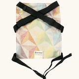 Didymos toy cotton carrier in the zephyr design laid flat showing buckles fastened 