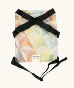 Didymos toy cotton carrier in the zephyr design laid flat showing buckles fastened 