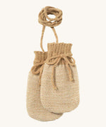 Disana organic merino wool baby mittens in light brown and natural colour on a cream background.