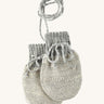 Disana organic merino wool baby mittens in grey and natural colour on a cream background.