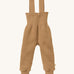 Disana organic merino wool dungarees in light brown on a cream background.
