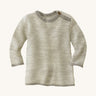 Disana organic merino wool melange jumper in a grey colour on a cream background.