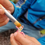Child using the brush from the Dr Zigs bubble pollinator kit